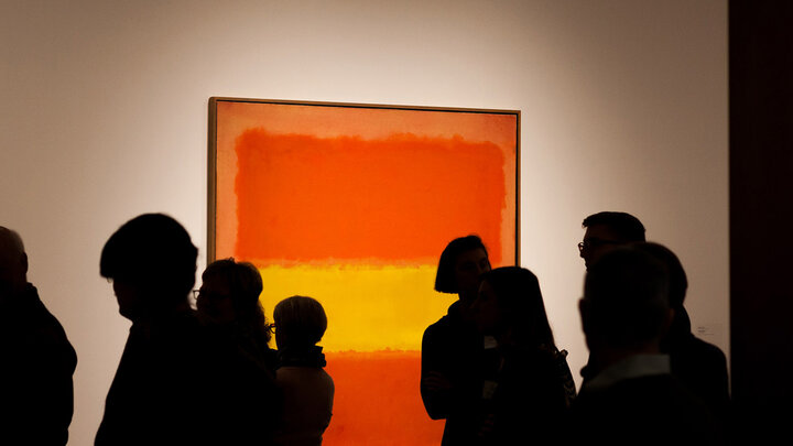 Visitors examine Mark Rothko's "Yellow Band," which is part of Sheldon Museum of Art's permanent collection.