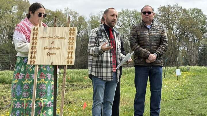 Cory DeRoin speaking at a garden event