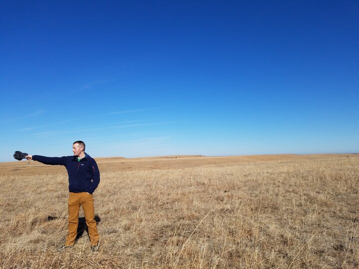 Stephen Bridenstine stands in the Flint Hills