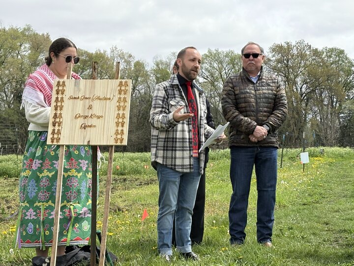 Cory DeRoin speaking at a garden event